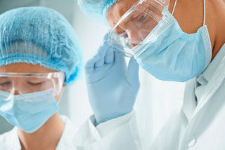 Disposable isolation gown displayed on a healthcare worker