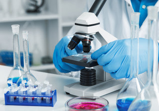 Autoclave, pipette, and microscope set used in modern science laboratories